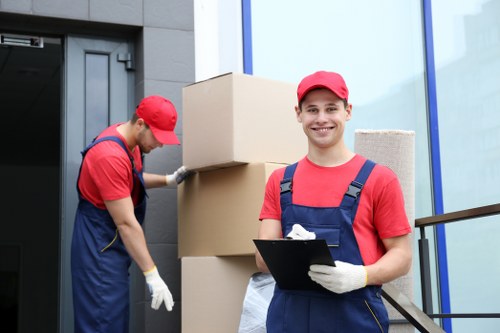 Professional movers carrying furniture in Kennington