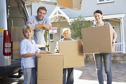 Movers carrying furniture during same day removals in Kennington