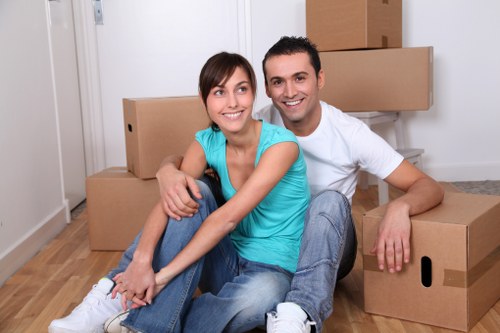 Kennington movers packing household items into sturdy boxes