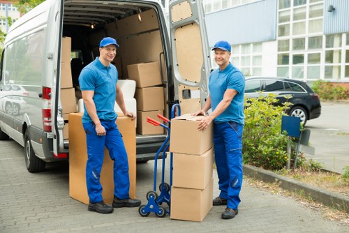 Professional team planning office removals in Kennington with boxes and desks