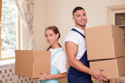 Packed boxes and workstation items ready for transport during a business relocation